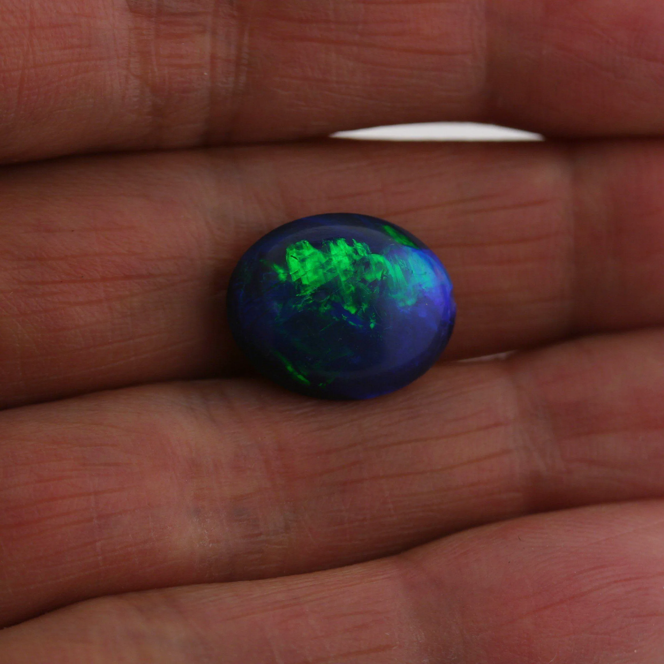 5.49 carat Bright Black Opal Oval Cabochon