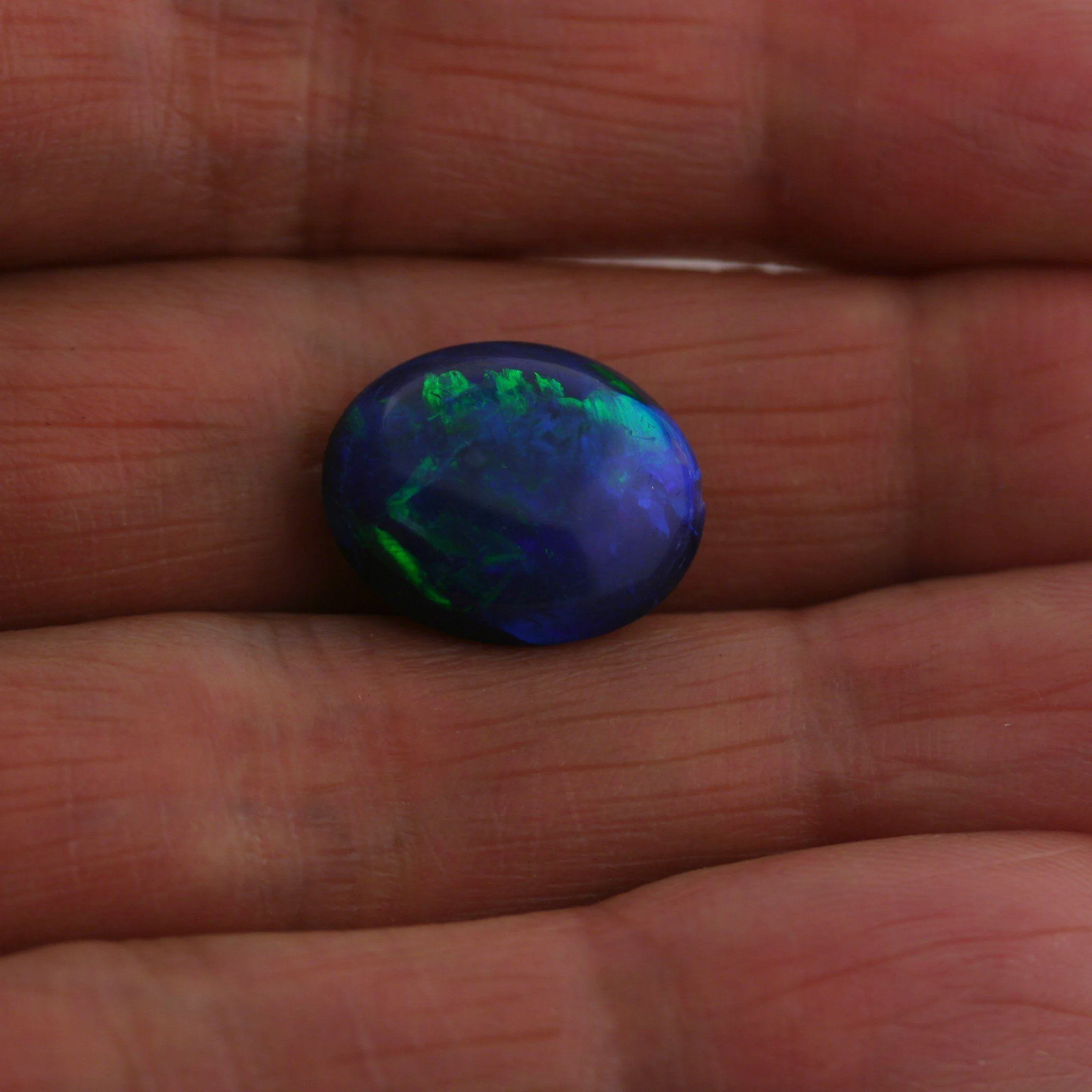 5.49 carat Bright Black Opal Oval Cabochon