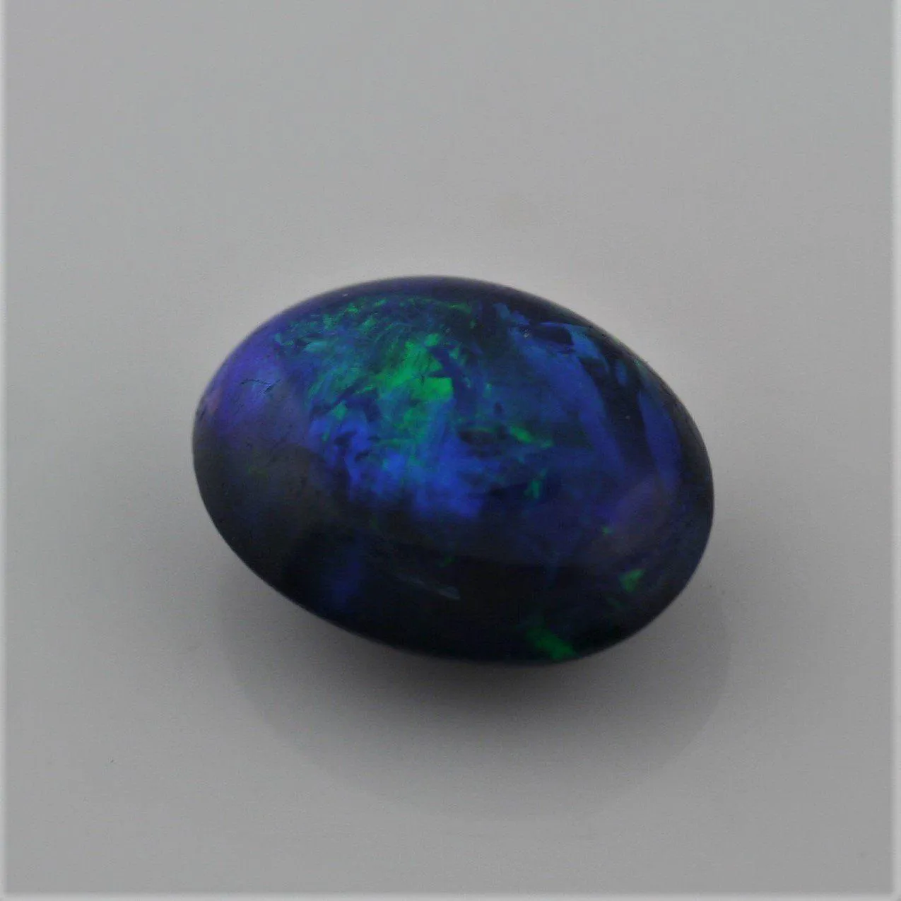 5.49 carat Bright Black Opal Oval Cabochon