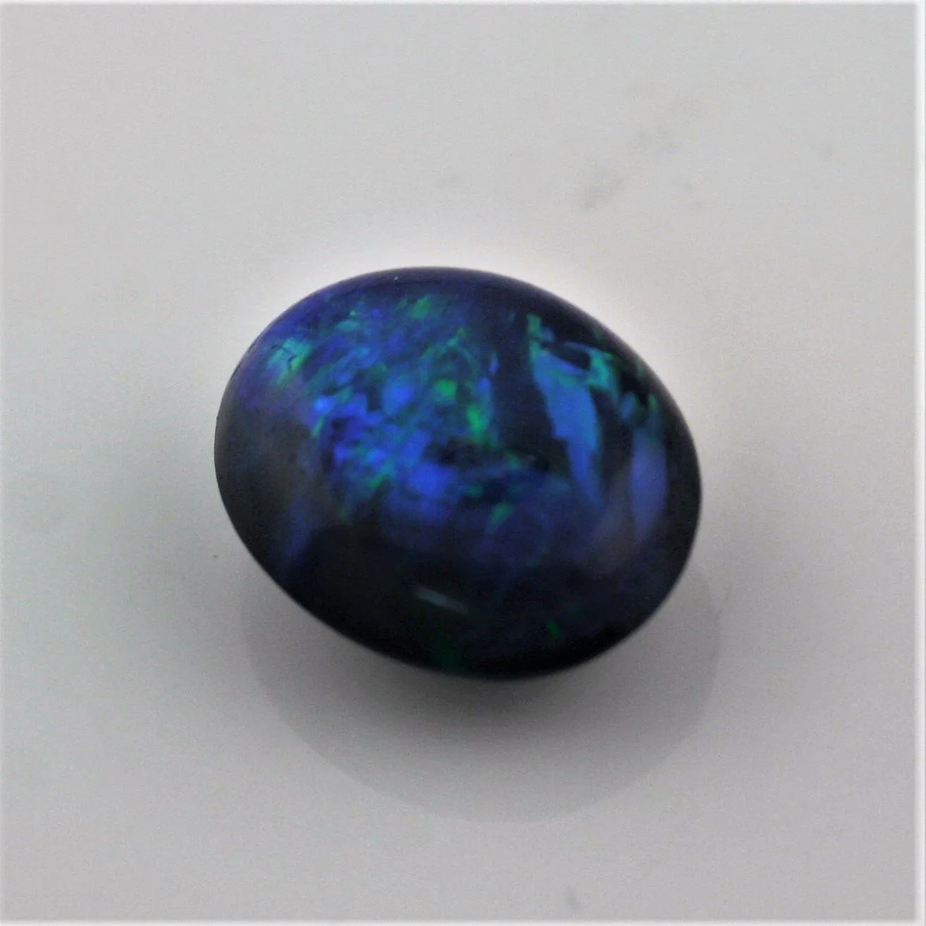 5.49 carat Bright Black Opal Oval Cabochon